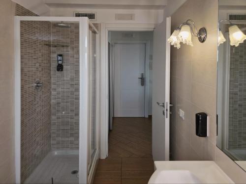 a bathroom with a shower and a sink at Porto Di Claudio in Fiumicino