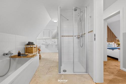 a bathroom with a shower with a glass door at Ferienhaus Philomena Dagebüll in Dagebüll