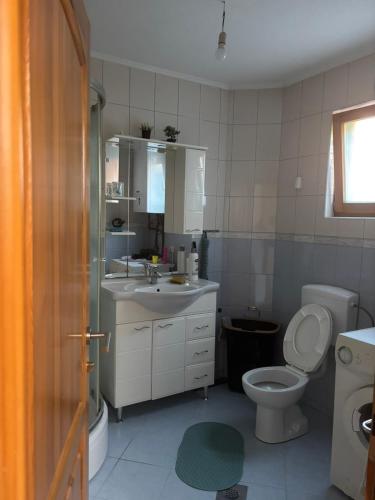 a bathroom with a toilet and a sink at Vila Sultan Sarajevo in Sarajevo