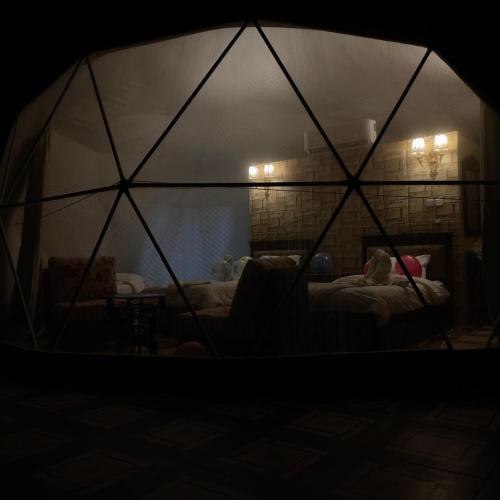 a room with a tent with a bed in it at Eva camp in Disah