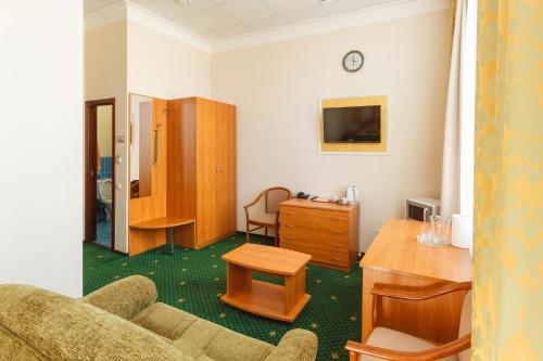 a living room with a couch and a table at Serpukhovskoy Dvor in Moscow