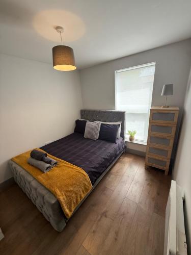 a bedroom with a bed and a window at Stonebarn New in Halton