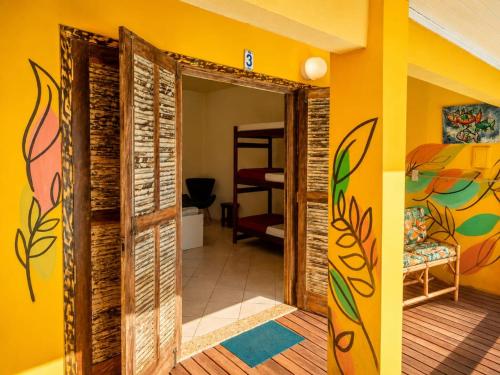 a room with a door open to a bedroom at Mansão Ouro Verde Beira Mar in Piçarras