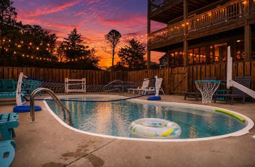 a swimming pool with a slide in the middle at OPM Coastal Retreat in Salvo