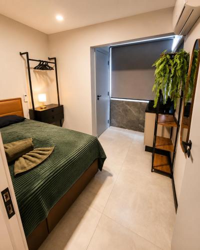 a bedroom with a bed and a sliding door at AP Central Aconchegante 03 Quartos Próx Unimed Com Garagem, Ar Quente Frio, Cozinha Completa - Até 06 Pessoas in Chapecó