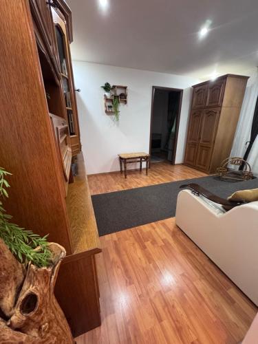 a living room with a couch and a table at Rustic Paradise Turda in Turda