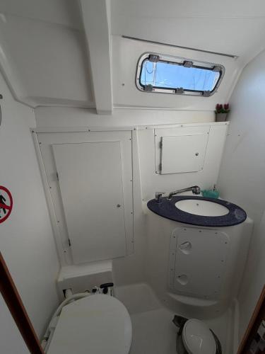 a small bathroom with a toilet and a sink at Dorfe Kotor Muo in Tivat