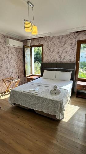 a bedroom with a large bed in a room at Terrace Urla in Urla