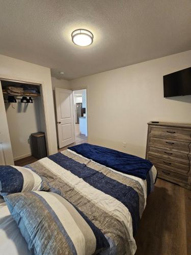 a bedroom with two beds and a dresser at Earl Street Retreat Unit A in Stanfield