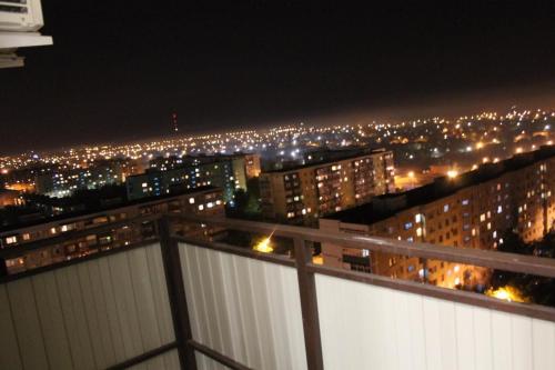 a view of a city at night with lights at Apartments on Chkalova in Maykop