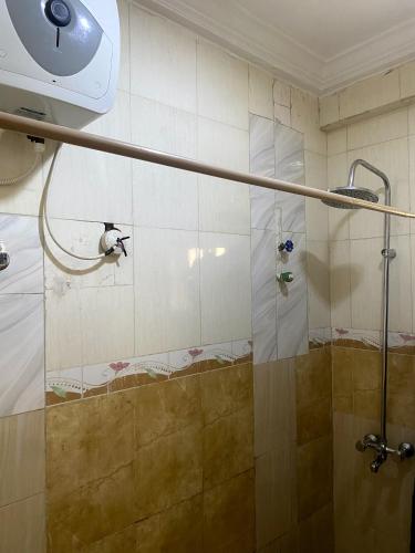 a shower in a bathroom with a shower at Mambillah Hotel Ikorodu in Ikorodu