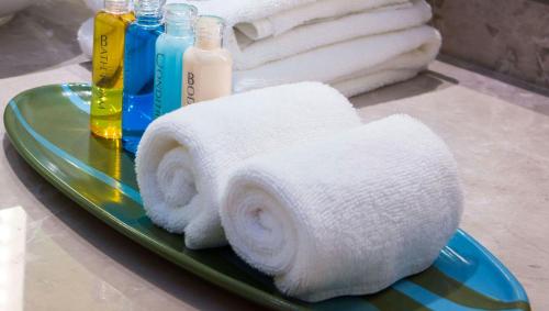 a plate with a roll of towels on a table at Keystone Boardwalk Inn and Suites in Keystone