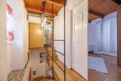 a staircase in a room with a white door at Castua Residence in Kastav