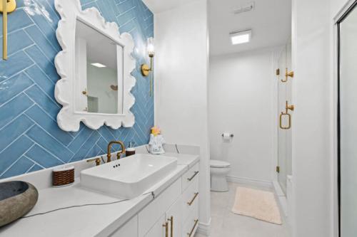 a bathroom with a sink and a mirror at Fishermans Landing on The Bay- Las Marinas in South Padre Island