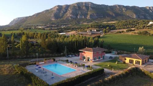 an aerial view of a house with a swimming pool at Villa Cilento Parking e Sosta Camper in Capaccio-Paestum