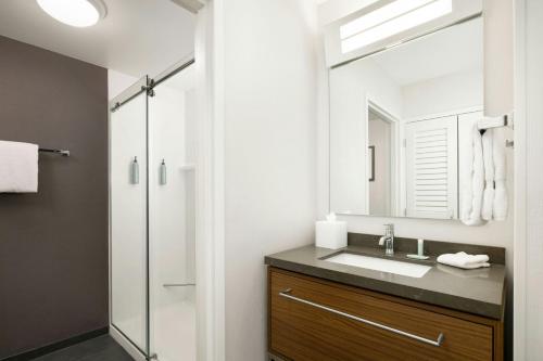 a bathroom with a sink and a shower at Courtyard by Marriott Concord in Concord