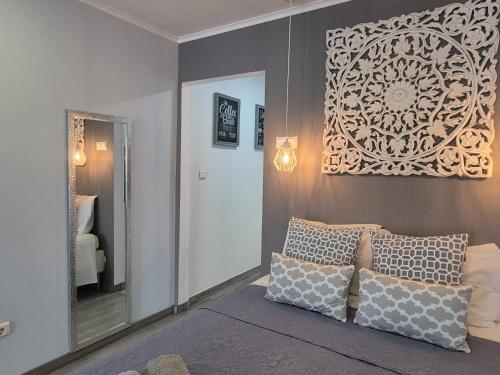 a living room with a couch and a mirror at V4 in Horta