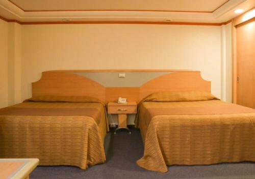 Postel nebo postele na pokoji v ubytování Hotel Milan CDMX