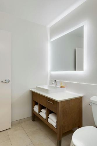 a bathroom with a sink and a mirror at Element by Marriott New Orleans Downtown in New Orleans