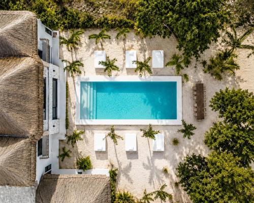 an aerial view of a building with a swimming pool at Villa Luxauthentika Tulum in Tulum