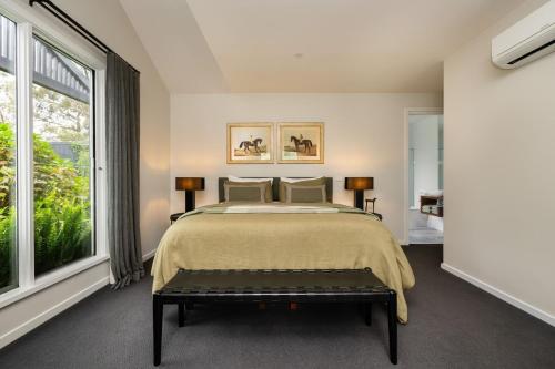 a bedroom with a large bed and a large window at Mysa Homestead in Tonimbuc