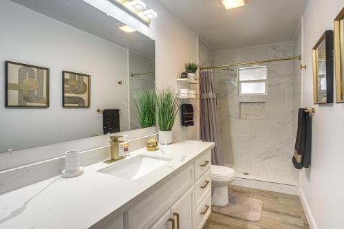 a bathroom with a sink and a shower and a toilet at Centrally Located Eagle Pass Home w/ Pool! in Eagle Pass