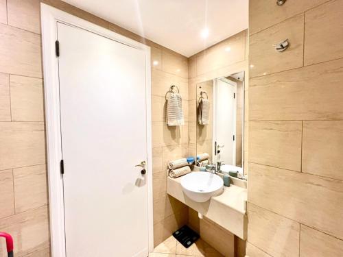 a bathroom with a sink and a mirror at Royal Breeze Executive Studio in Ras al Khaimah