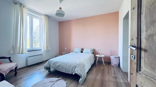 a bedroom with a bed and a window at Le refuge de Boncelles in Seraing