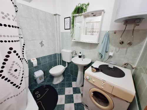 a small bathroom with a sink and a toilet at Atelier22 in Prilep