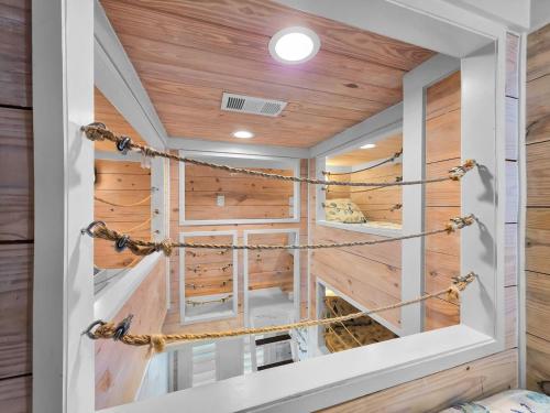 a room with wood paneling and a ceiling with ropes at Luxury Beachfront Ocean Views Pool Access Sleeps15 in Bolivar Peninsula