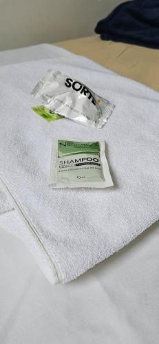 a dollar bill sitting on top of a white shirt at Hotel Pasettus in Bela Vista do Paraíso