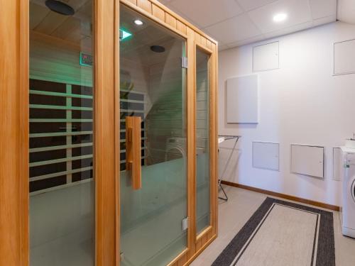 a glass door in a room with a toilet at Pabstin in Sankt Lambrecht