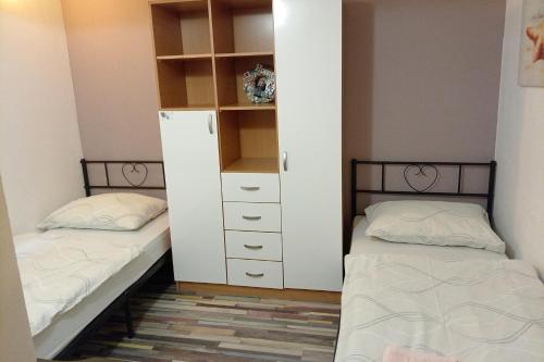 Apartments with parking space Senj - 25932