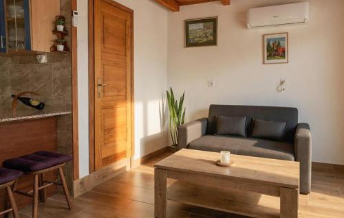a living room with a couch and a table at Stunning Home In Kutina With Sauna in Kutina