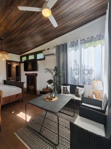 a living room with a couch and a table at Secret Hideaway in Guápiles