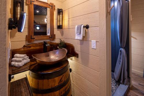 a bathroom with a wooden sink and a wooden barrel at "Morning Wood" Luxury Treehouse Retreat Near Dollywood & Pigeon Forge in Sevierville