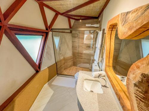 a bathroom with a sink and a shower at Ville do Lago in Gravatá