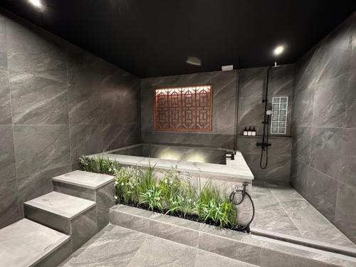 a bathroom with a shower and a bath tub at 광안해옥 in Kwangan-dong