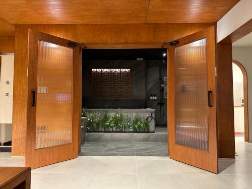 an open door into a room with a garden at 광안해옥 in Kwangan-dong