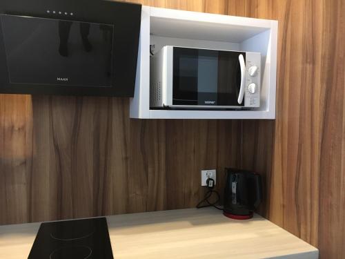 Nowy Świat Leza Apartamentsにあるテレビまたはエンターテインメントセンター