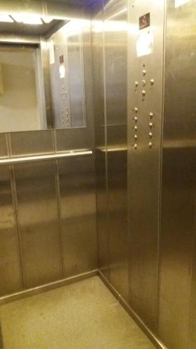 an elevator in a building with its doors open at Warsaw Center - Apartment near Central Railway Station in Warsaw