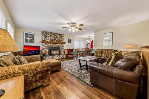 a living room with leather furniture and a fireplace at 838 Placer Avenue home in South Lake Tahoe