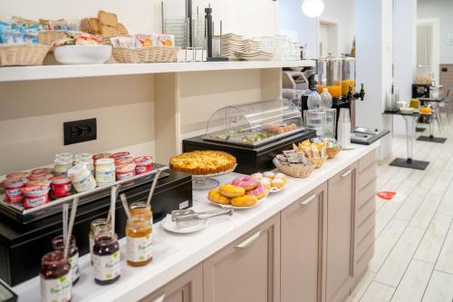 a buffet line with many different types of food at Alloggi Liviana Pontecorvo in Padova