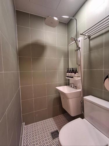a bathroom with a toilet and a mirror at Rio Hotel-Hoegi Station, Subway Line 1 in Seoul