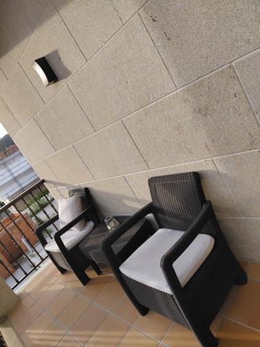 an overhead view of two chairs and a ceiling at A casa de Aliciña in Sanxenxo