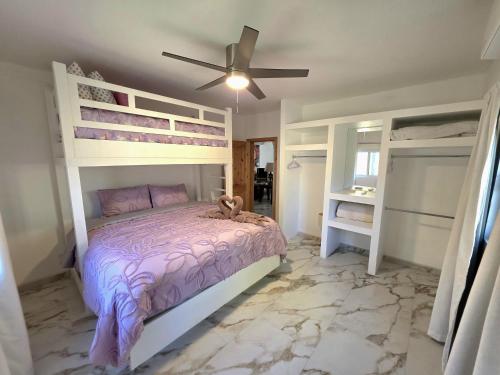 a bedroom with a bed and a ceiling fan at Casa Mona MODERN Beach Home in Puerto Peñasco
