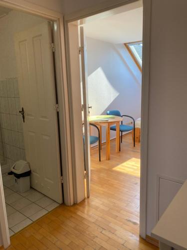 an open door to a room with a table and chairs at Haus Panorama in Tylkowo