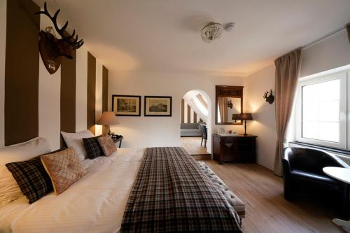 a bedroom with a large bed and a window at Ferienhaus Lemmerheide in Rüthen