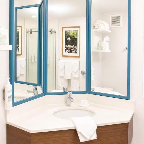 a bathroom with a sink and a mirror at Hampton Inn Summersville in Summersville