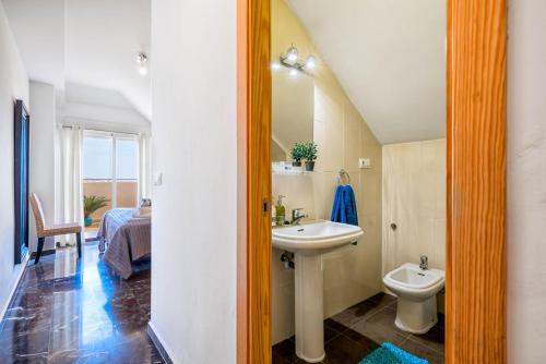 a bathroom with a sink and a toilet at Carvajal Luxury Apartments - Free Parking in Fuengirola